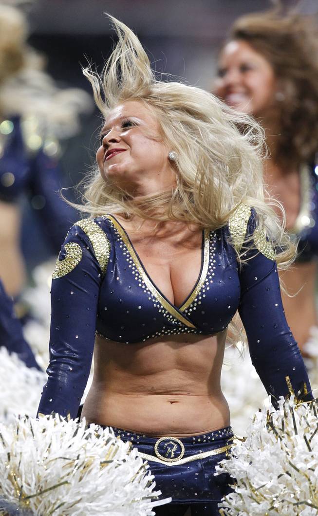 A St. Louis Rams cheerleader performs during the fourth quarter of an NFL football game between the St. Louis Rams and the Tennessee Titans Saturday, Aug. 20, 2011, in St. Louis. The Rams won 17-16. 