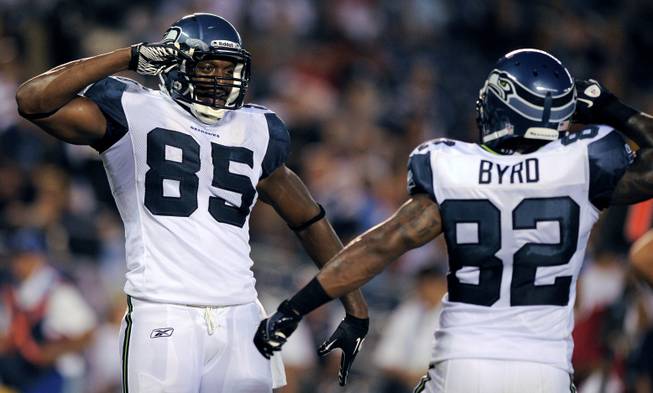 Seattle Seahawks tight end Anthony McCoy, left, and tight end Dominique Byrd celebrate after McCoy scored a touchdown against the San Diego Chargers during the second half of a preseason NFL football game Stadium on Thursday, Aug. 11, 2011, in San Diego. Seattle won 24-17. 