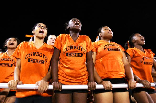 Cheerleaders Elsha Harris, a senior, from left, sophomore Zaakirah Muhammad, sophomore Trynice Gordon and junior Quiana Forbes cheer for the team during Chaparral High School's first football game at Moapa Valley High School in Overton Friday, September 2, 2011.