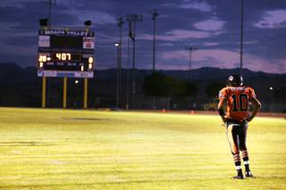 Chaparral player James Bryant pauses during the first quarter of Chaparral High School's first football game against Moapa Valley High School in Overton Friday, September 2, 2011.
