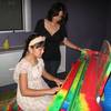 Victoria Young, 11, plays a song while her piano teacher Damaris Alvarez watches closely. Alvarez has taught Young since she was 5 years old.