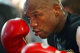 Undefeated welterweight boxer Floyd Mayweather Jr. works out with a heavy bag at the Mayweather Boxing Club Tuesday September 6, 2011. Mayweather challenges WBC welterweight champion Victor Ortiz for the WBC title at the MGM Grand Garden Arena Saturday, September 17.