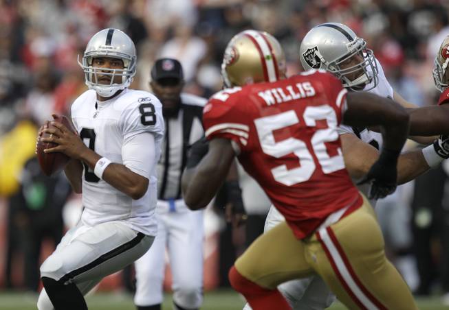 San Francisco's Patrick Willis chases down Oakland Raiders quarterback Jason Campbell.