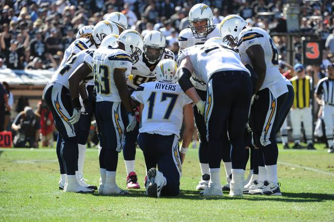 Chargers quarterback Philip Rivers speaks to his teammates in a huddle in this file photo.