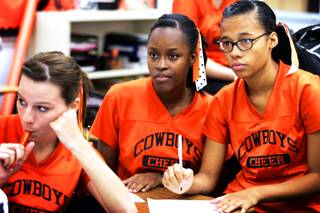 Seniors Crystal Carter, center, and Elsha Harris, right, listen during a student council meeting at Chaparral High School in Las Vegas on Thursday, Sept. 8, 2011.