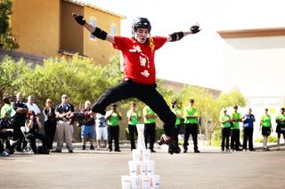 Cory Patton of Greenwood, Louisiana performs his finale move, jumping over a pyramid stack of SONIC cups, during the So You Think You Can Skate freestyle finals, part of the 2011 Dr. Pepper SONIC Games held at a SONIC Drive-In on E. Lake Mead Parkway in Henderson Monday, September 12, 2011.
