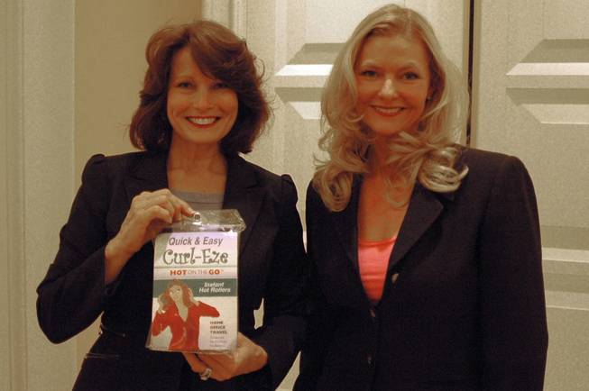 Debra Weisser (right) of Tampa Bay, Fla., poses with her invention, Curl-Eze, during TeleBrands' Inventors Day event at Encore on Sept. 12, 2011. With her is Lana Lum, who handles marketing for the product.