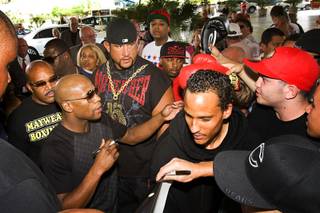 Undefeated welterweight boxer Floyd Mayweather Jr. signs autographs for fans during official arrivals at the MGM Grand on on Tuesday, Sept. 13, 2011. Mayweather will challenge WBC welterweight champion Victor Ortiz for the title at the MGM Grand Garden Arena on Saturday.