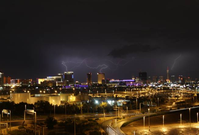 Lightning flashes above the Las Vegas Valley early Tuesday morning during a thunderstorm that brought heavy rains and several reports of lightning strikes. Around 6,000 NV Energy customers lost power for about 90 minutes in downtown Las Vegas during the storm, a utility spokeswoman said.