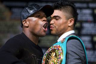 Undefeated boxer Floyd Mayweather Jr. and WBC welterweight champion Victor Ortiz face off during a news conference at the MGM Grand Wednesday, September 14, 2011. Mayweather will challenge Ortiz for the title at the MGM Grand Garden Arena on Saturday.