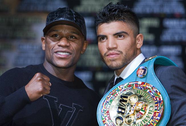 Undefeated boxer Floyd Mayweather Jr. and WBC welterweight champion Victor Ortiz pose during a news conference at MGM Grand on Wednesday, Sept. 14, 2011. Mayweather will challenge Ortiz for the title at MGM Grand Garden Arena on Saturday.
