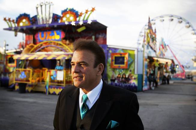 Tony Sacca, entertainment director, stands near the rides during the San Gennaro Feast at the Rio on Wednesday, Sept. 14, 2011.