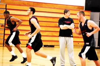 UNLV men's basketball coach Dave Rice watches as the team runs sprints during its first workout of the fall on the UNLV campus Thursday, Sept. 15, 2011.