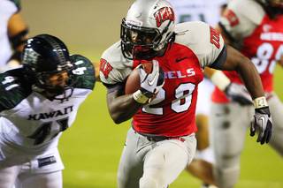 UNLV's Bradley Randle is chased down by  Hawaii's Corey Paredes during the first half of UNLV's home opener Saturday, Sept. 17, 2011.