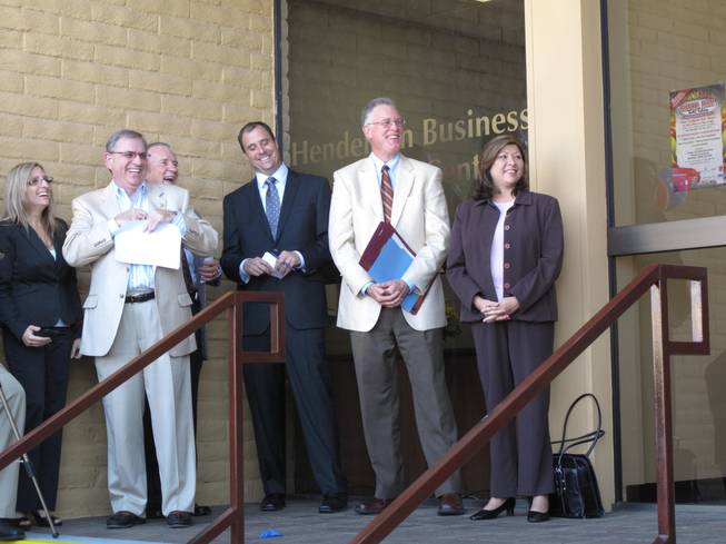 City of Henderson and Henderson Chamber of Commerce officials celebrate the 10th anniversary of the Henderson Business Resource Center. From left are Rebecca Fay, the center's director, Wells Fargo Bank Regional President Kirk Clausen, USAA Savings Bank President Larry Seedig, chamber President Scott Muelrath, Mayor Andy Hafen and Councilwoman Gerri Schroder.