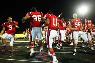 Liberty players celebrate their 26-20 win over Silverado with a haka Friday, September 23, 2011.