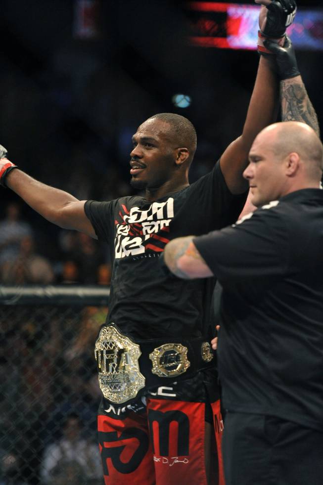 Jon Jones, of Endicott, N.Y., celebrates after beating Rampage Jackson, of Irvine, Calif., to retain his UFC light heavyweight title, Saturday, Sept. 24, 2011, in Denver.  Jones won the fight with a knockout in the fourth round.