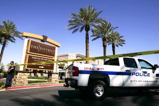 The scene of a shooting involving a man and Henderson Police officers at the District on Green Valley Parkway in Henderson on Monday, Sept. 26, 2011.
