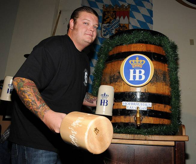 Corey Harrison taps the keg for Oktoberfest at Hofbrauhaus on ...