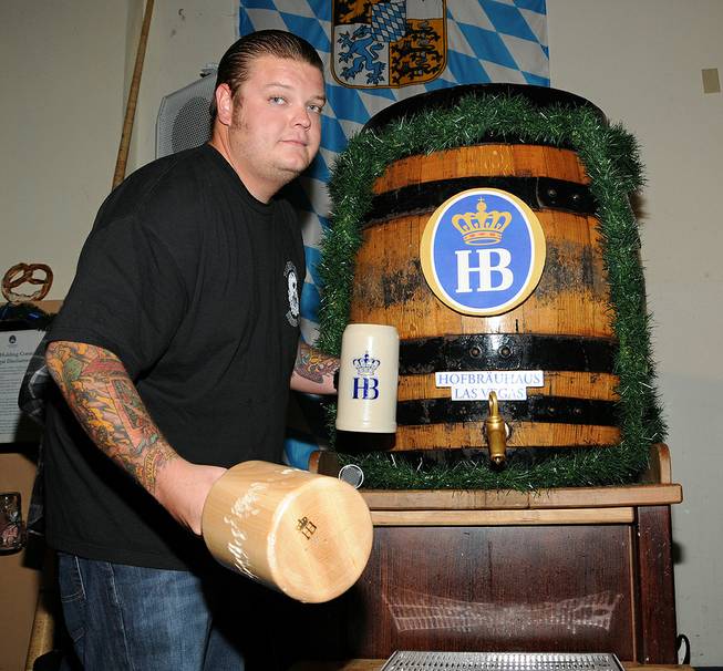 Corey Harrison taps the keg for Oktoberfest at Hofbrauhaus on ...