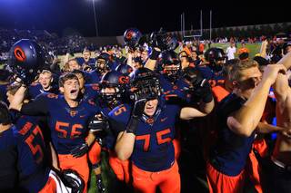 Bishop Gorman players celebrate their 31-28 win over Servite Friday, Sept. 30, 2011.