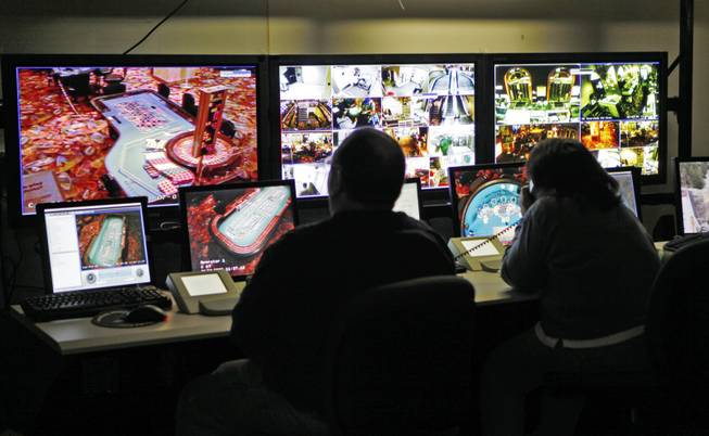 Workers monitor the security cameras at the Fortune Valley Casino in Central City, Colo.