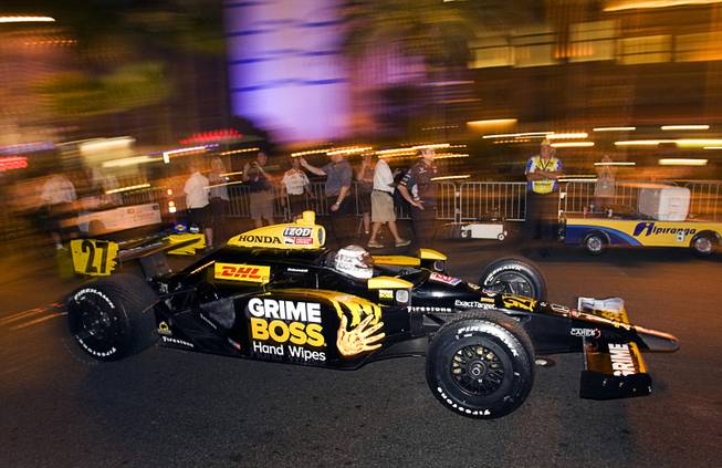 IndyCar driver Mike Conway of England arrives in front of the Bellagio on the Las Vegas Strip Thursday, Oct. 13, 2011. The IZOD IndyCar World Championship race will be held at the Las Vegas Motor Speedway Sunday.