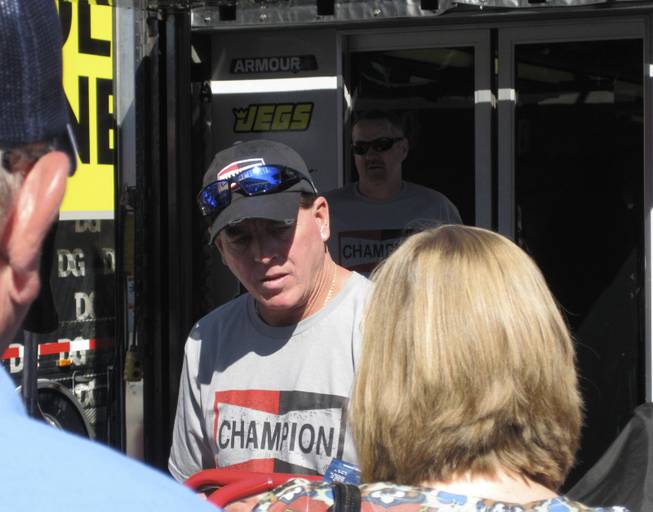Race winner Ron Hornaday signing autographs before the race.