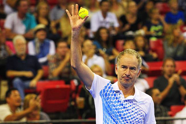 John McEnroe waves to the crowd during the Las Vegas stop of the 2011 Champions Series Tennis tournament Saturday, Oct. 15, 2011.