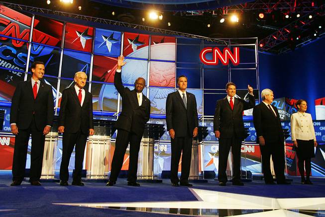 Rick Santorum, Ron Paul, Herman Cain, Mitt Romney, Rick Perry, Newt Gingrich and Michele Bachmann are introduced before the GOP presidential debate sponsored by CNN on Tuesday, Oct. 18, 2011, at the Venetian.