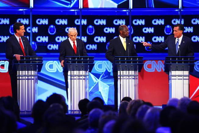 Rick Santorum, Ron Paul, Herman Cain and Mitt Romney are seen during the GOP presidential debate sponsored by CNN on Tuesday, Oct. 18, 2011, at the Venetian.