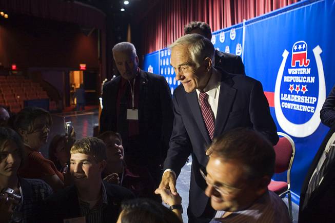 Congressman Ron Paul of Texas greets with supporters after speaking at the Western Republican Leadership Conference at the Venetian Wednesday, Oct. 19, 2011.
