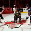 A professional Harold Camping impersonator drops a ceremonial puck between team captains Mike Madill and Dylan Yeo during "Rapture Night" as the Wranglers and Reign faced off at Orleans Arena on Friday, Oct. 21, 2011.