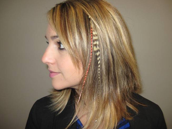 Diana Filipescu models her feather hair extensions at the Greenspun Media Group building on October 21, 2011.