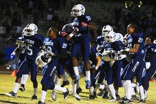 Canyon Springs players celebrate after making a two point conversion in overtime against Las Vegas during their game Thursday, Oct. 27, 2011. Canyon Springs won the game 22-21.