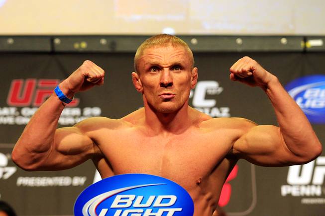 Dennis Siver flexes during the weigh in Friday, Oct. 28, 2011 for UFC 137 at the Mandalay Bay Events Center.