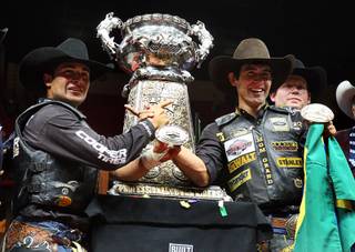 Brazilian bull riders Robson Palermo, left, and  Silvano Alves celebrate during the Professional Bull Riders World Finals at the Thomas and Mack Center Sunday, Oct. 30, 2011. Palermo won the Las Vegas event and $250,000. Alves won the series championship and $1 million.