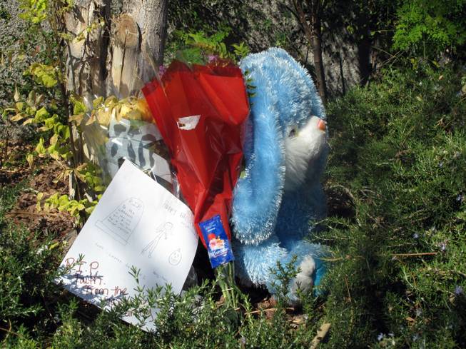 A small memorial sits near West Wesley Lake Place and South Sandstone Bluffs Drive where 12-year-old Faith Monet Love was struck by a vehicle and killed Oct. 31, 2011, while trick-or-treating.