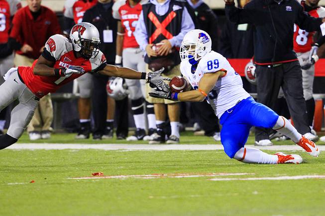 Boise State wide receiver Tyler Shoemaker misses a pass while being covered by UNLV defensive back Will Chandler during their Mountain West Conference game Saturday, Nov. 5, 2011 at Sam Boyd Stadium.