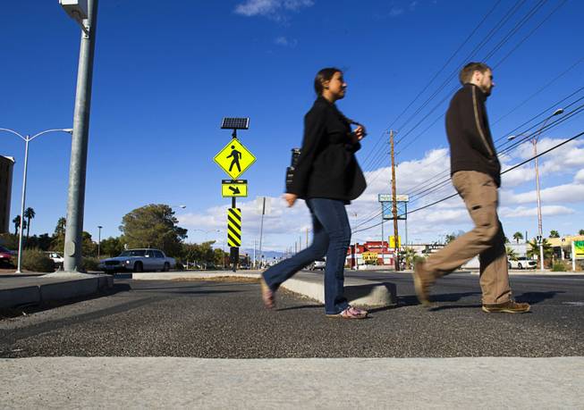 Pedestrians use a Danish offset as they cross Maryland Parkway on Monday, Oct. 7, 2011, near UNLV. A Danish offset is in the median area where the crosswalk makes an S turn, slowing down pedestrians and making them look at traffic before they cross.