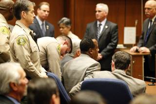Dr. Conrad Murray is remanded into custody after a jury returned with a guilty verdict in his involuntary manslaughter trial Monday, Nov. 7, 2011, in a Los Angeles courtroom. Murray was convicted in a trial that painted him as a reckless caregiver who administered a lethal dose of a powerful anesthetic that killed Michael Jackson.