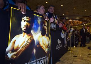 Boxing fans wait for Filipino boxer Manny Pacquiao to make his official arrival at the MGM Grand on Tuesday, Nov. 8, 2011. Pacquiao will face Mexican boxer Juan Manuel Marquez for the third time when they fight at the MGM Grand Garden Arena on Saturday.