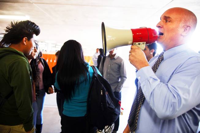 Dean Scott Littlefield employs a loudspeaker between classes to help herd the students at Chaparral High School in Las Vegas Tuesday, November 8, 2011.