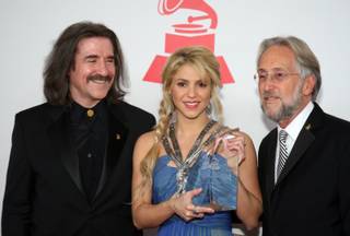 Honoree Shakira, center, poses with Luis Cobos, left, Chairman of the Latin Recording Academy, and  Neil Portnow, National Academy of Recording Arts and Sciences (NARAS) President/CEO, at the 2011 Latin Recording Academy's Person of the Year tribute dinner and concert at the Mandalay Bay Wednesday, November 9, 2011.