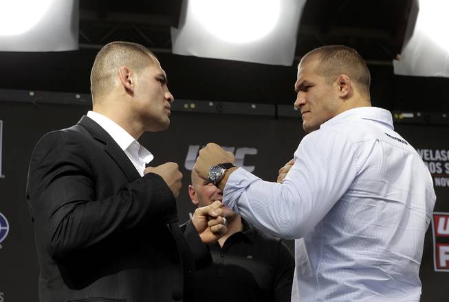 Cain Velasquez and Junior dos Santos square off in a press event this week in Los Angeles. Velasquez and dos Santos fight for the UFC heavyweight title Saturday, Nov. 12, 2011, in Anaheim, Calif.