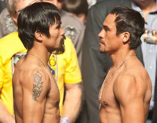 Manny Pacquiao and Juan Manuel Marquez's weigh-in at MGM Grand Garden Arena on Nov. 11, 2011.