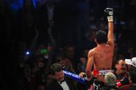 Juan Manuel Marquez salutes his fans after his 12-round, WBO welterweight title fight against Manny Pacquiao Saturday, Nov. 12, 2011 at the MGM Grand Garden Arena. Pacquiao won by majority decision.
