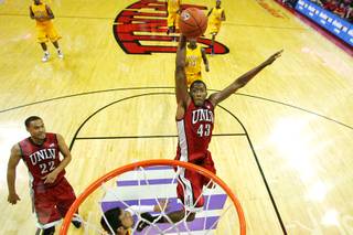 UNLV forward Mike Moser sails in for a dunk against Canisius during the second half of their game Thursday, Nov. 17, 2011. Moser had 19 points and nine rebounds in UNLV's 95-70 win.