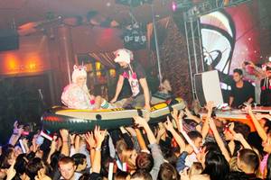 Holly Madison and DJ Steve Aoki surf the crowd at Surrender on Nov. 18, 2011.
