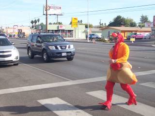 Metro Police officer Michael Lemley dresses in a turkey suit to cross Charleston Boulevard in efforts to promote traffic safety, Nov. 22, 2011.